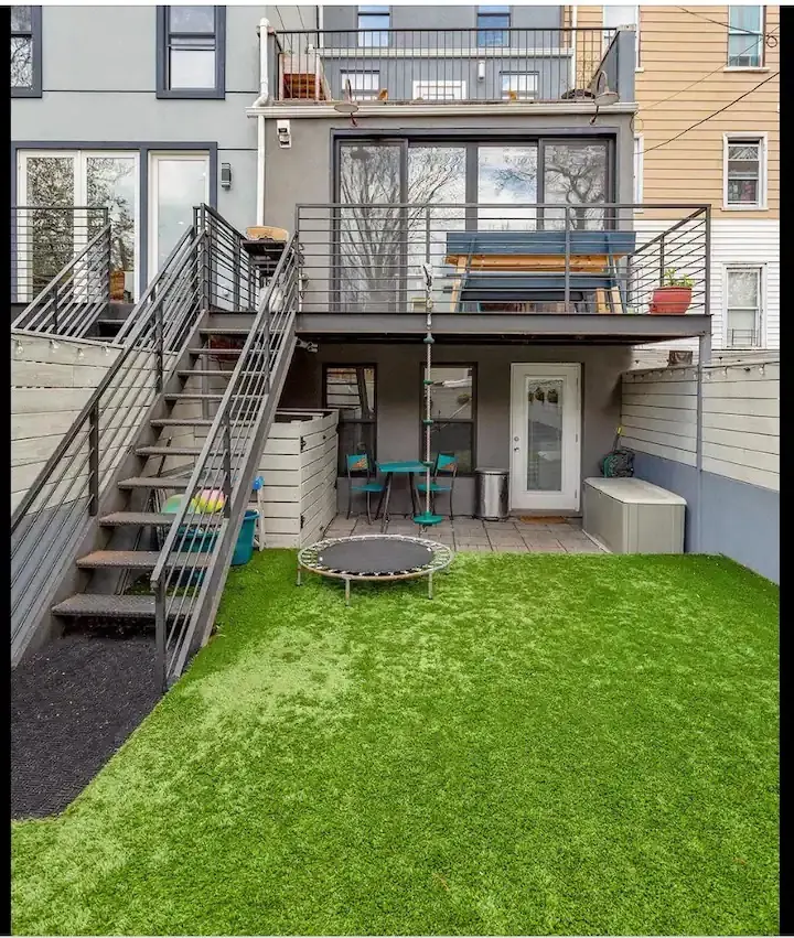 Modern backyard with artificial grass.