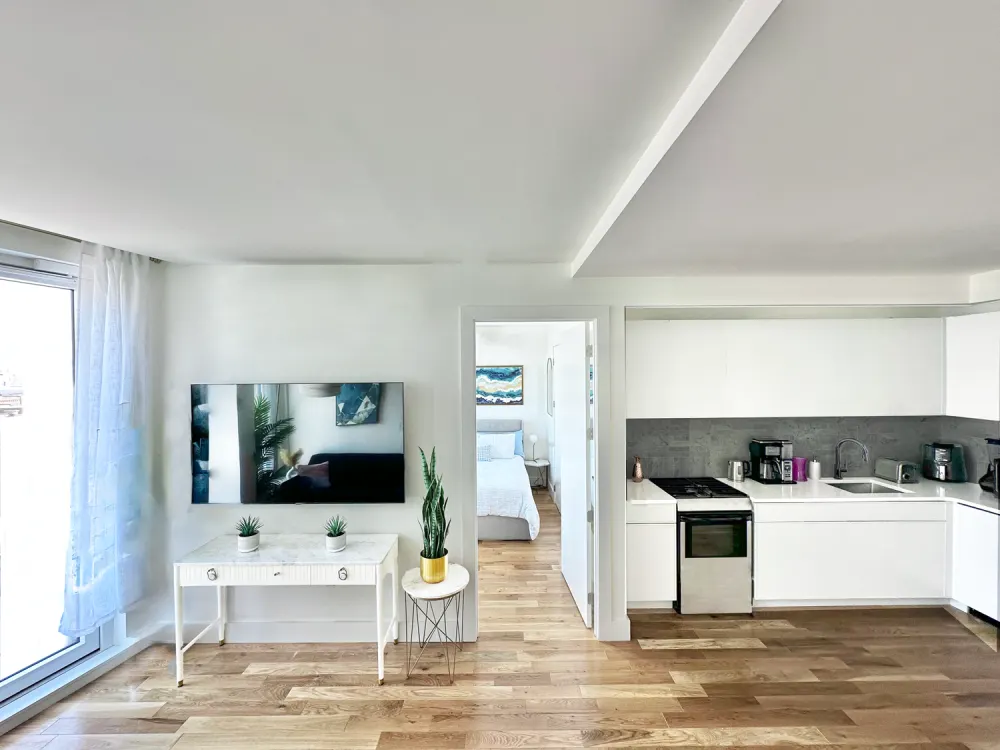 Modern open-concept apartment with kitchen.