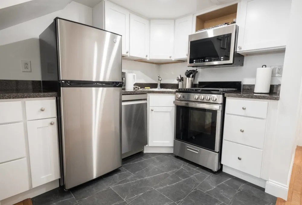 Modern kitchen with stainless steel appliances.