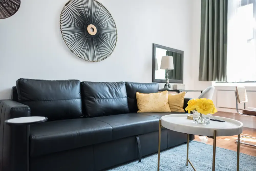 Modern living room with black sofa