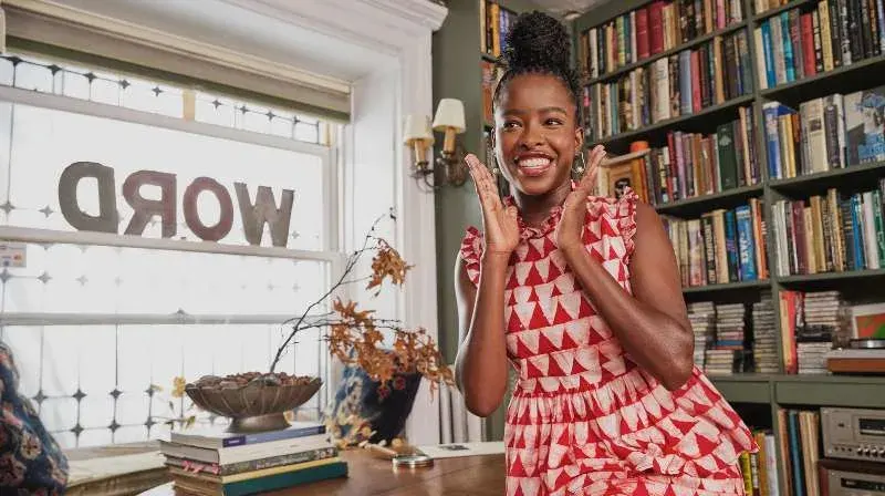 Smiling person in cozy bookshop