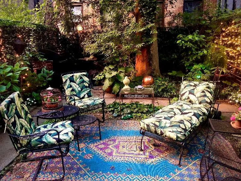 Lush garden patio, leafy cushions