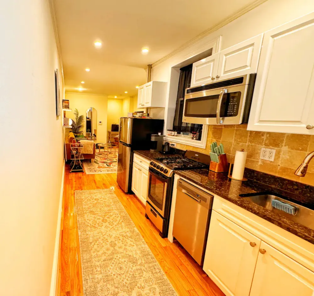 Modern kitchen with adjacent living area.