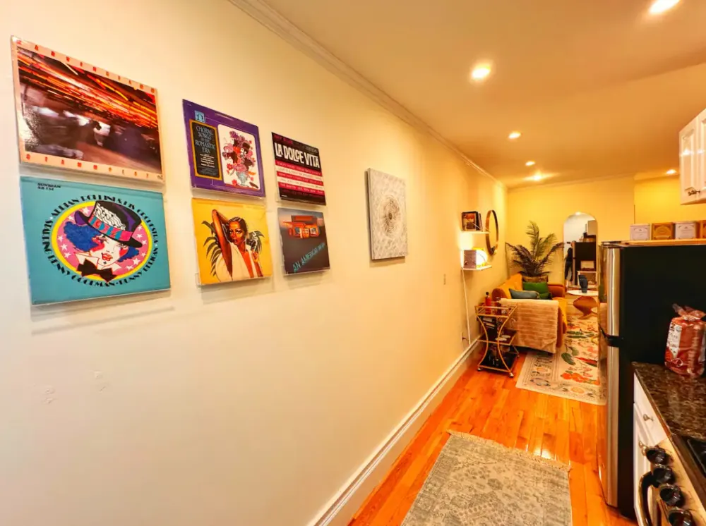 Cozy, art-filled apartment hallway.