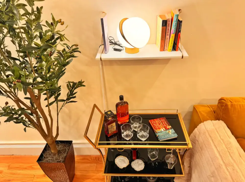 Elegant bar cart with whiskeys.