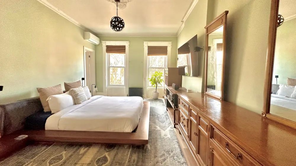 Bright, spacious bedroom with elegant decor.