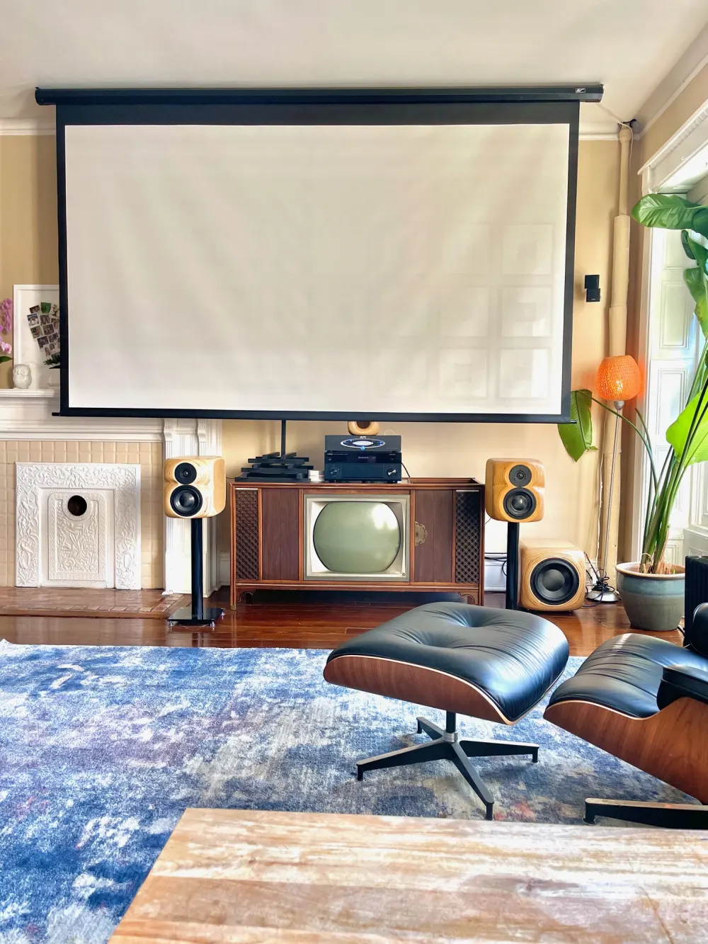 Modern living room with projector screen.