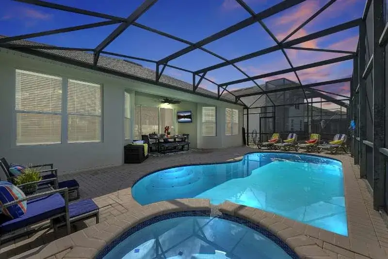 Screened pool with hot tub