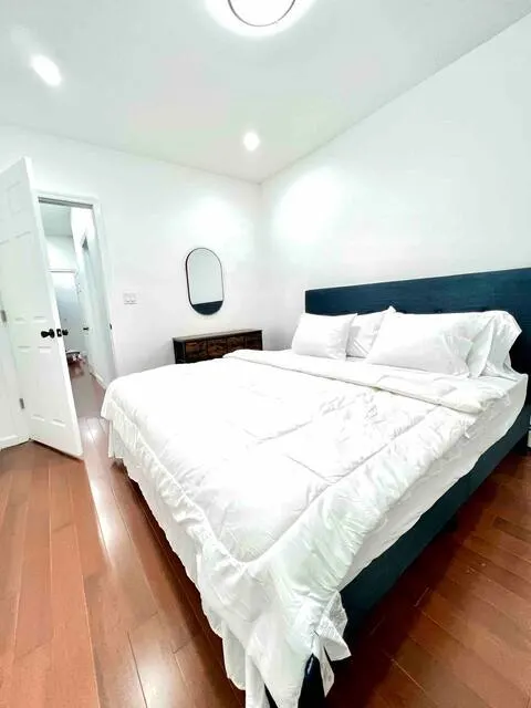 Bright, modern bedroom with bed.