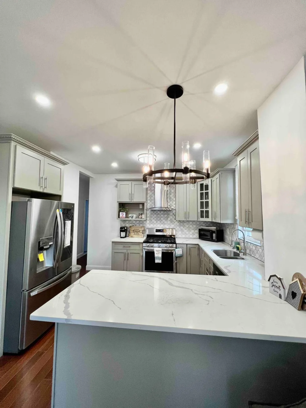 Modern kitchen with marble countertops.