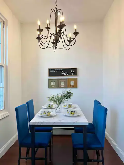 Elegant dining area with chandelier.