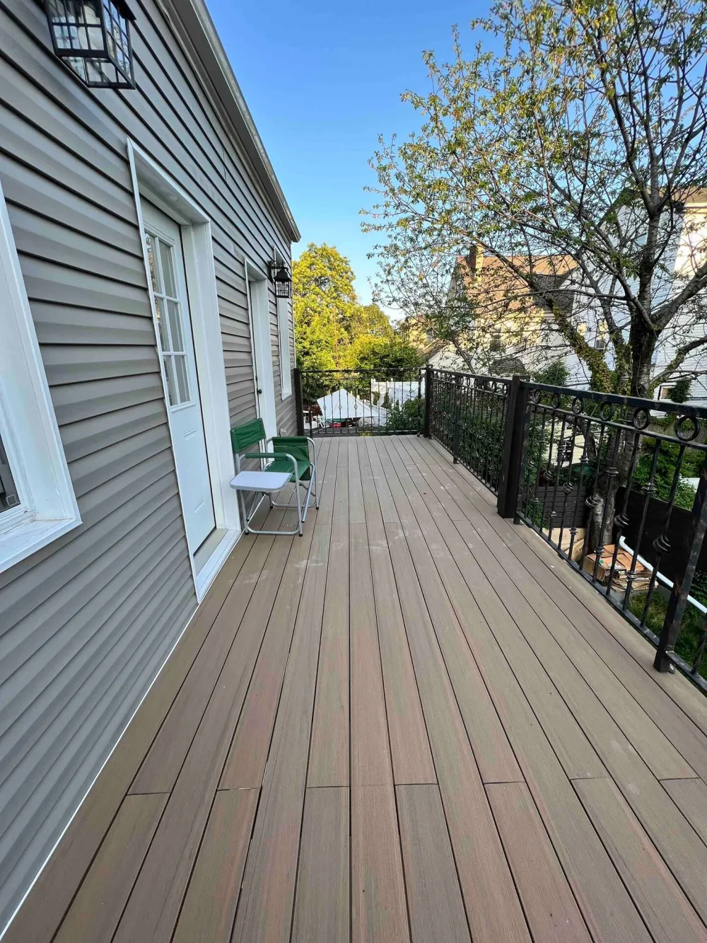 Spacious wooden deck with seating.