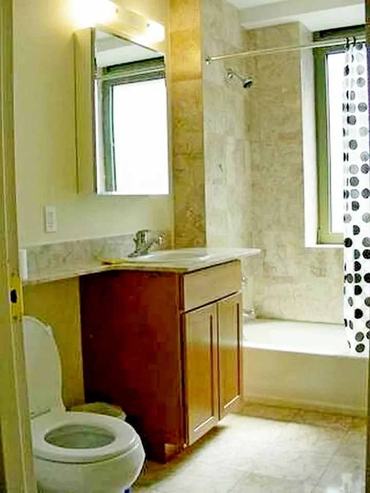 Modern bathroom with wood vanity.