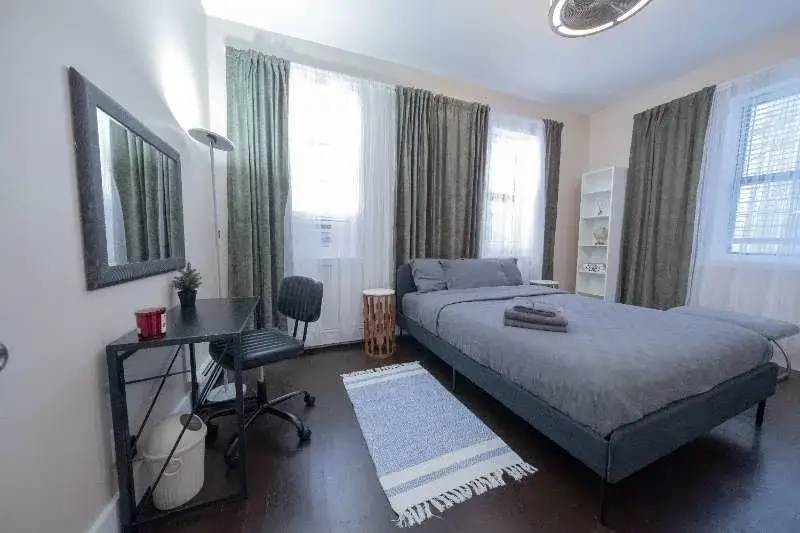 Cozy modern bedroom with workspace