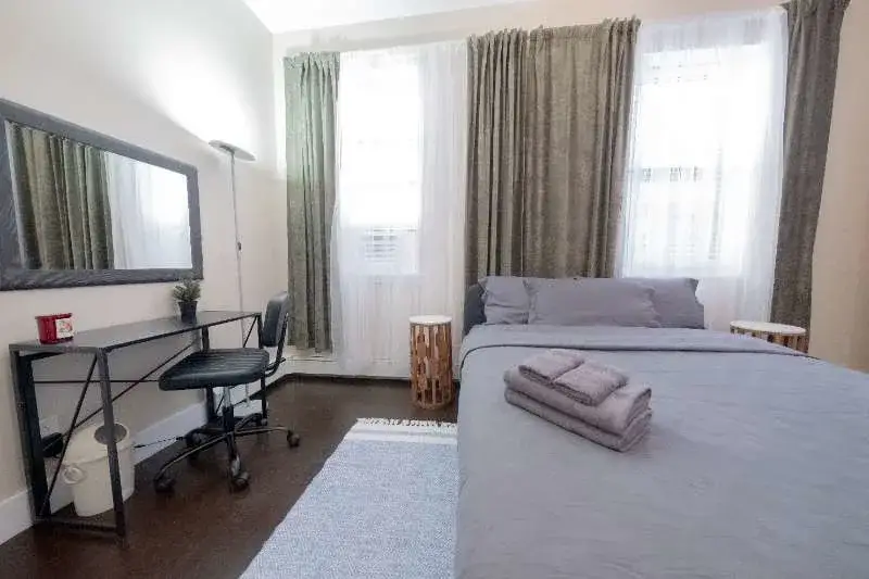 Cozy bedroom with desk, bed