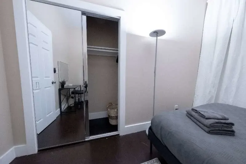 Simple bedroom with mirrored closet