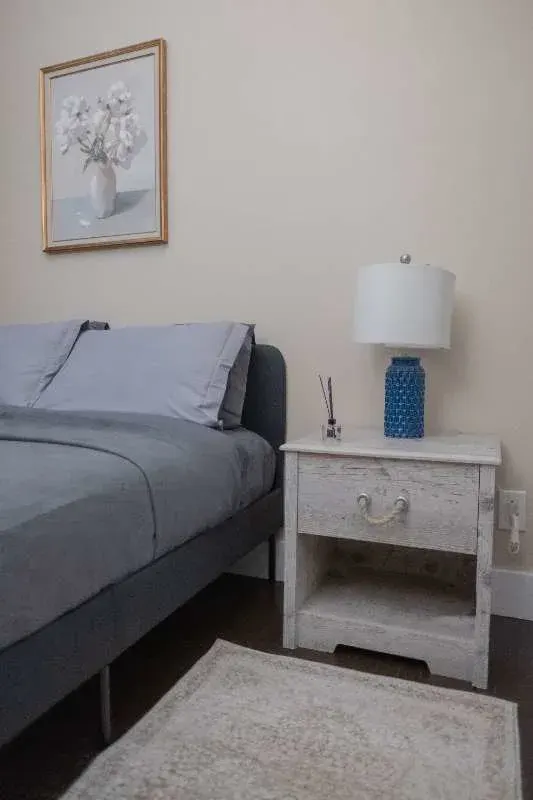 Cozy bedroom corner with lamp