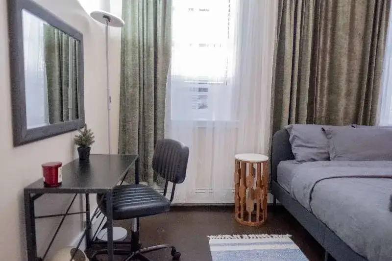 Cozy minimalist bedroom with workspace