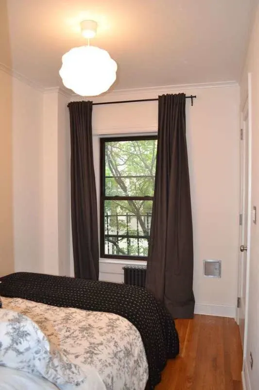 Cozy small bedroom with window