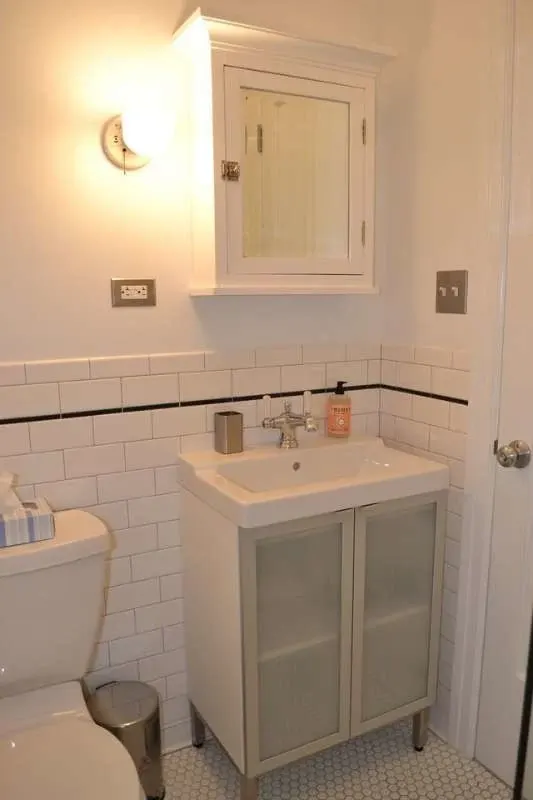 Compact white bathroom with sink