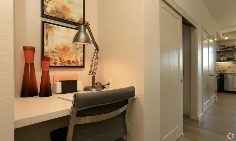 Cozy desk nook with lamp.