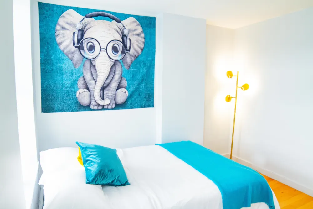 Bright bedroom with elephant tapestry