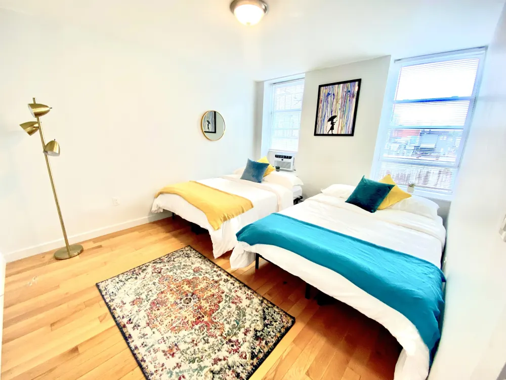 Bright room with two beds.