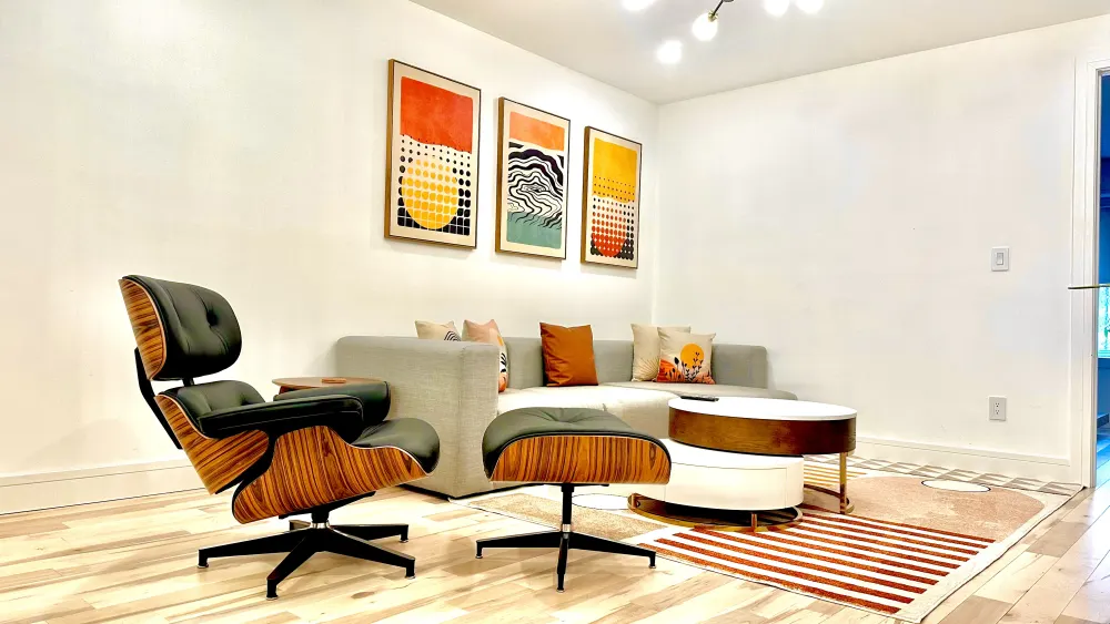 Eames-style chair, sofa, colorful art