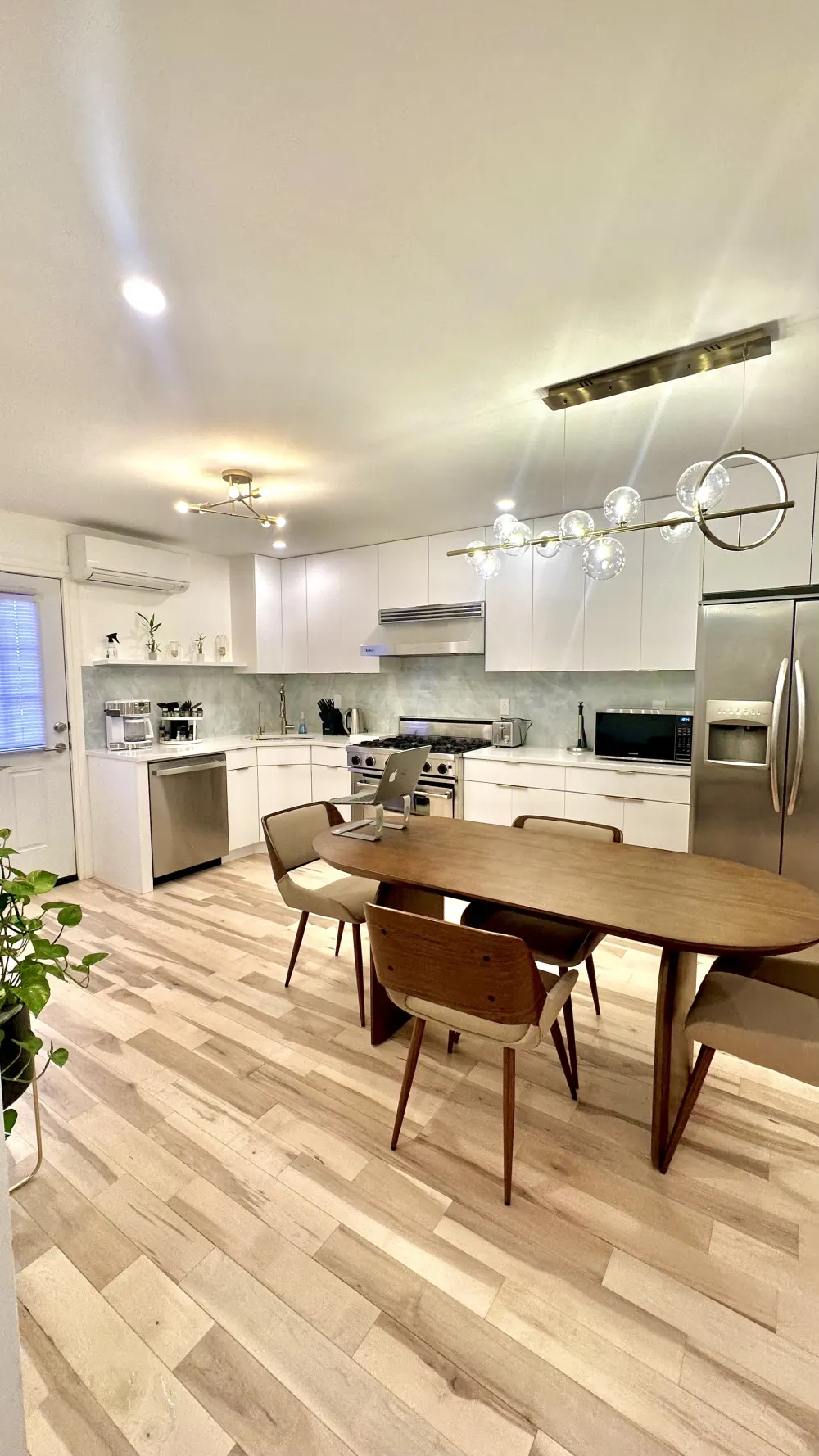 Modern kitchen with stylish dining area.