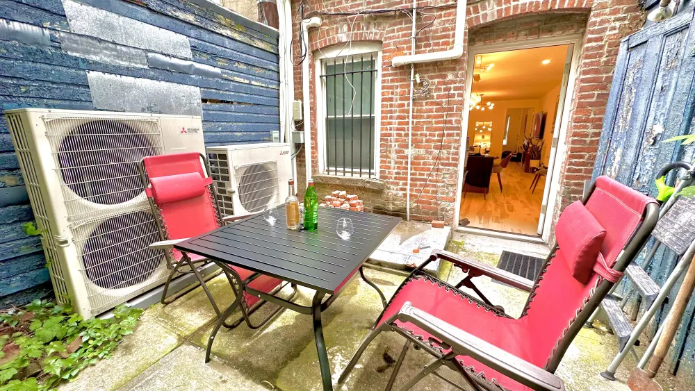 Small cozy brick-walled patio