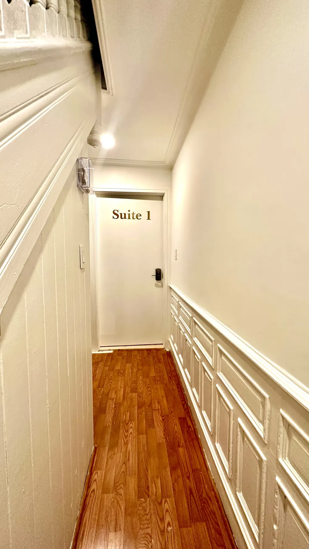 Hallway with Suite 1 door.