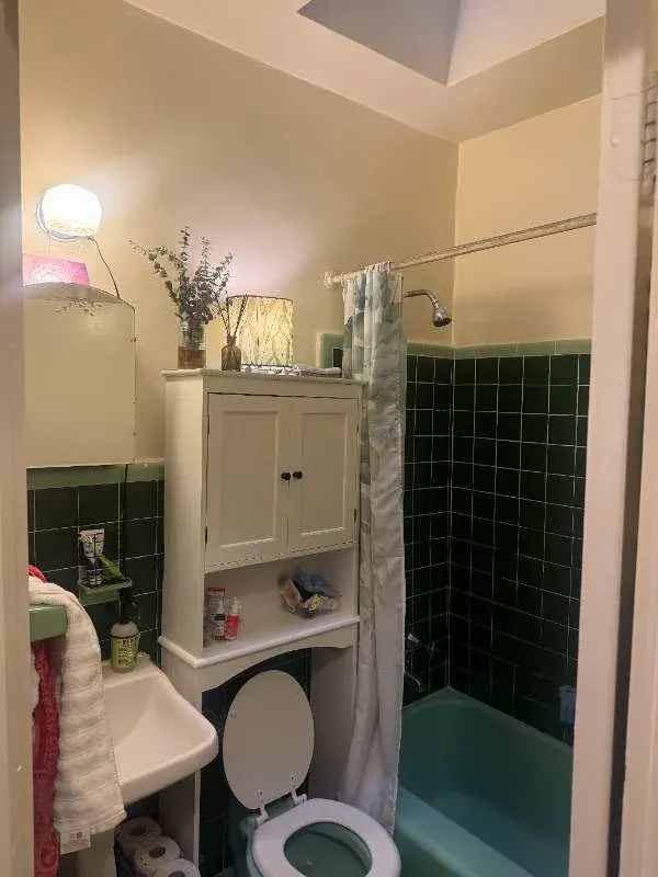 Cozy vintage bathroom, teal tub