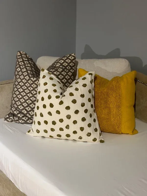 Cream couch with decorative pillows