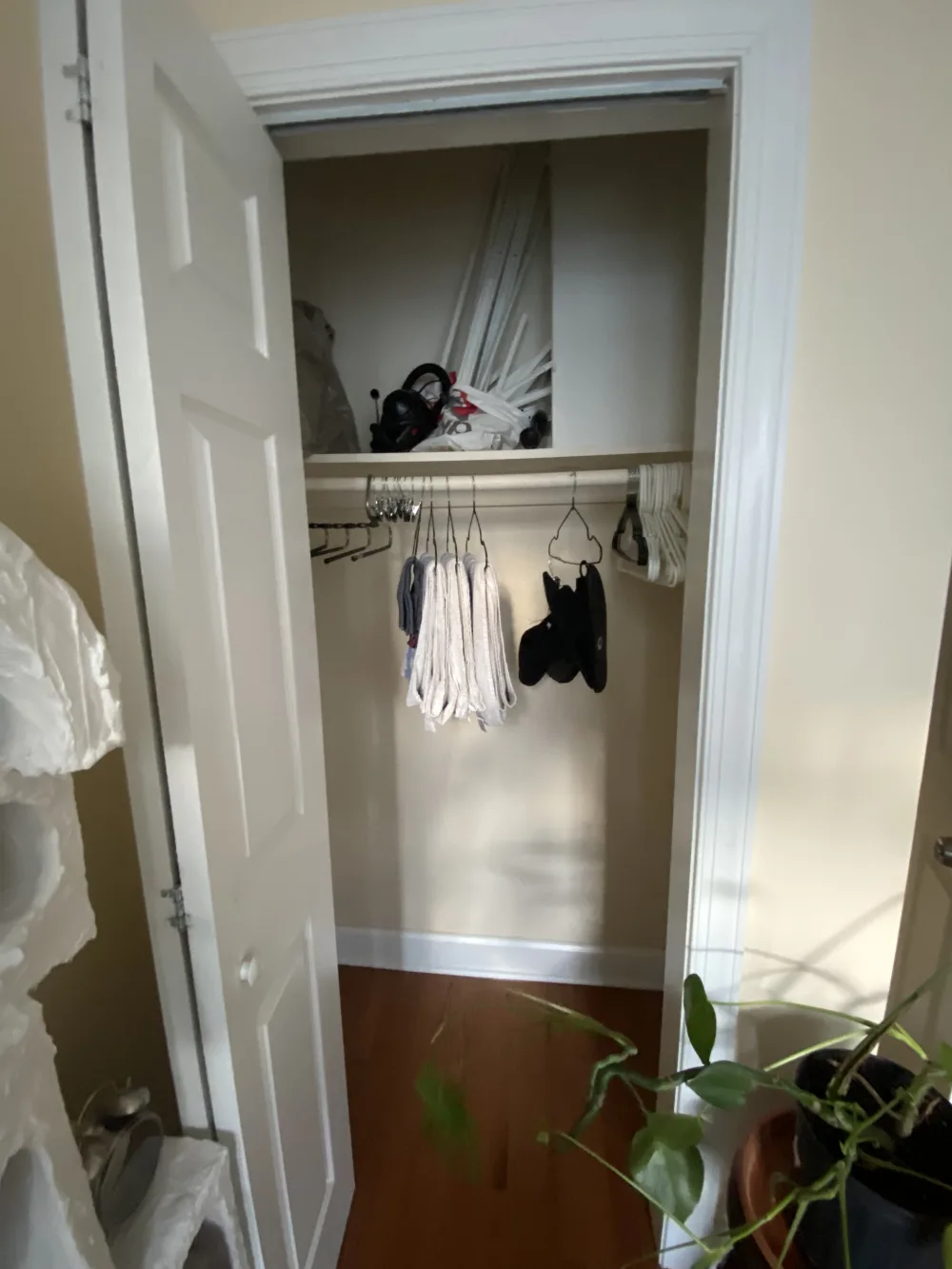 Open closet with various items.