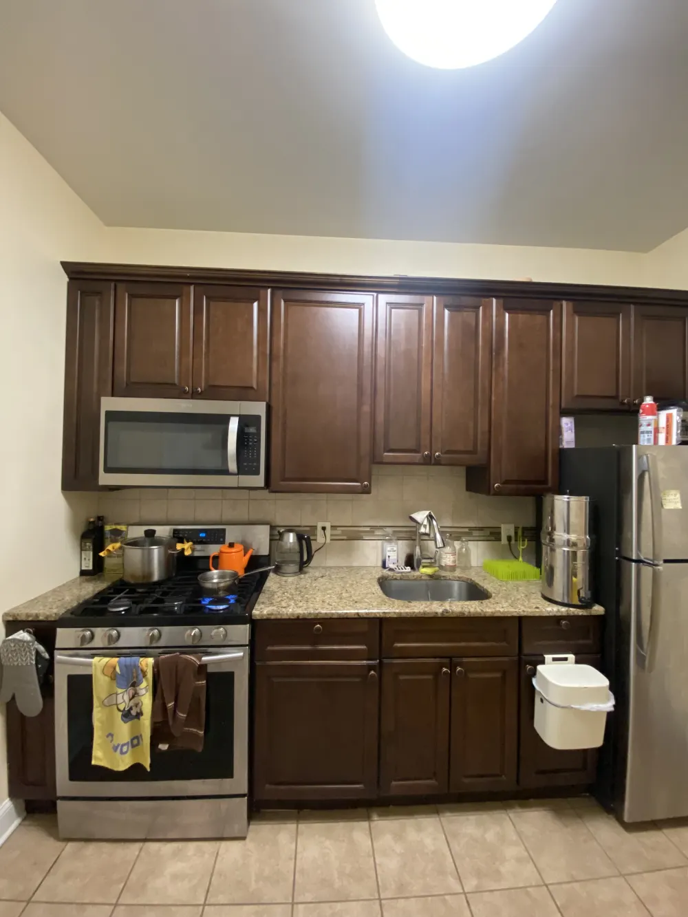 Cozy kitchen with wooden cabinets.