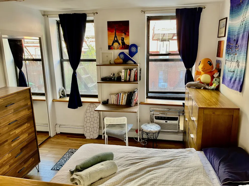 Cozy sunlit bedroom with shelves