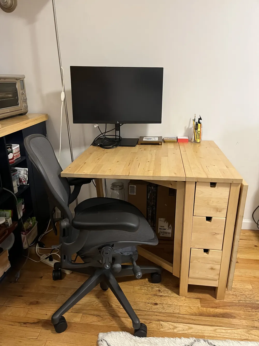 Cozy desk setup with monitor.