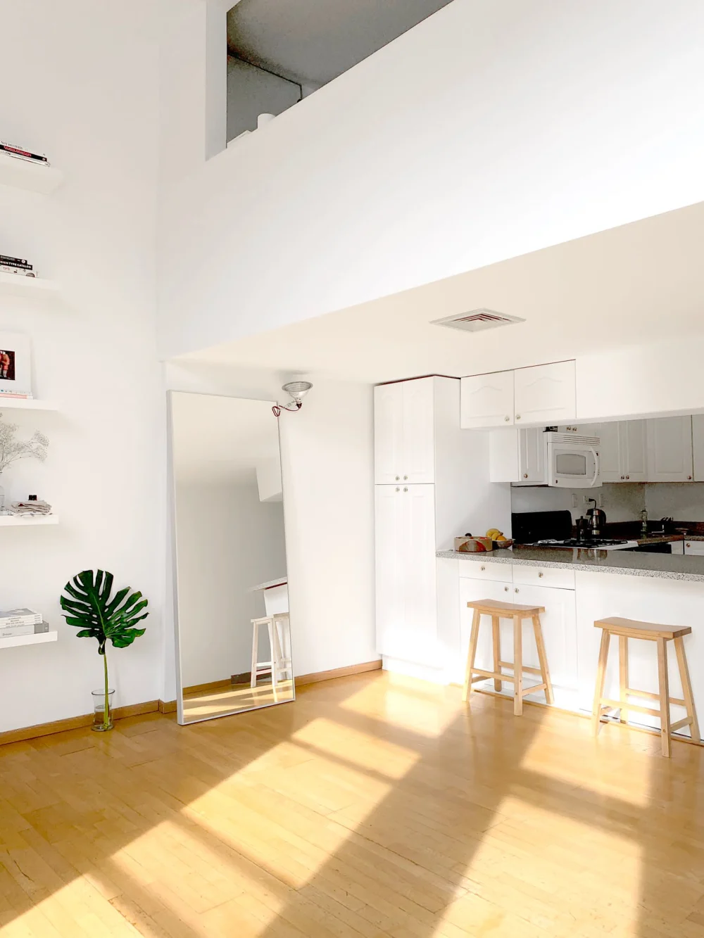 Bright, minimalist loft kitchen interior.