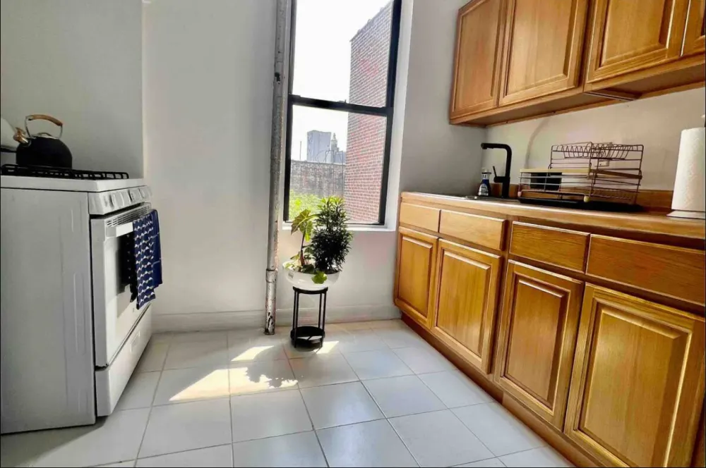 Bright kitchen with wooden cabinets.