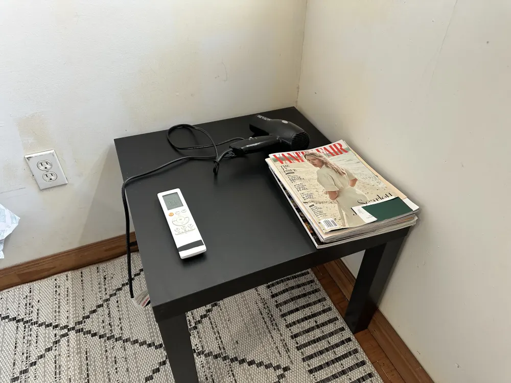 Black side table with essentials.
