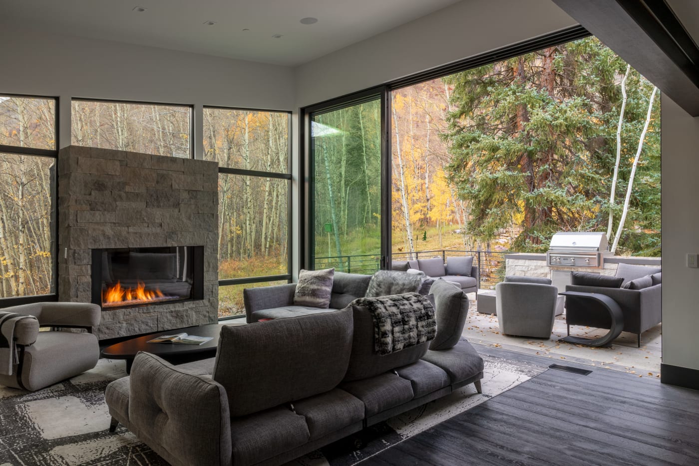Floor-to-ceiling glass opening to the landscape