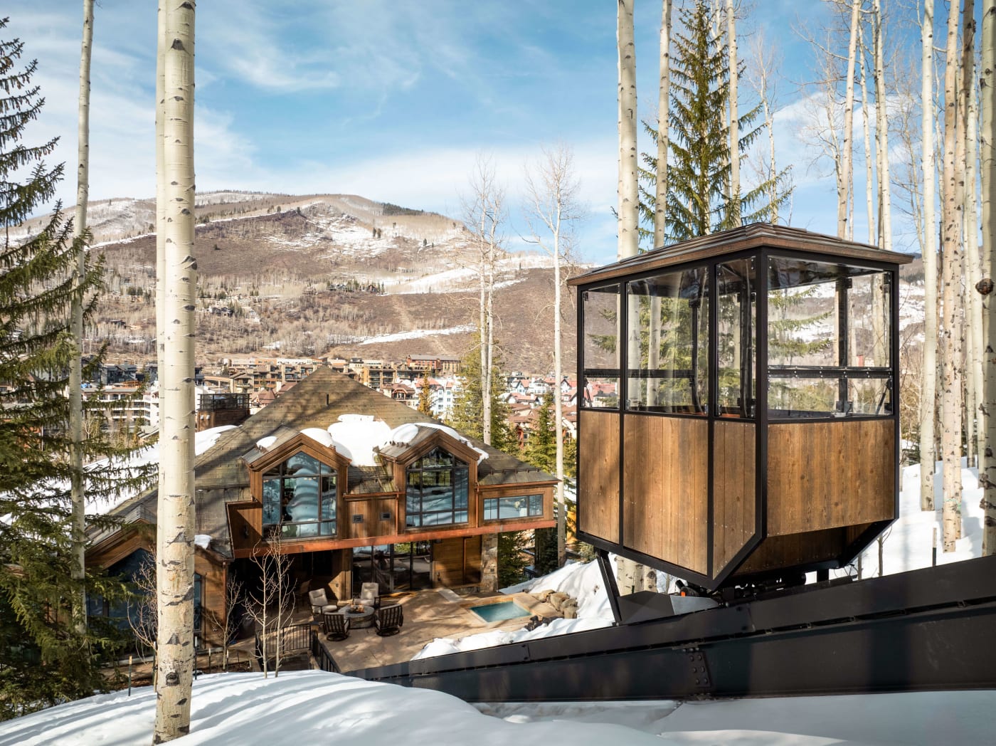 Forest Road Ski Home, Vail — glass funicular overlooking snowy Vail
