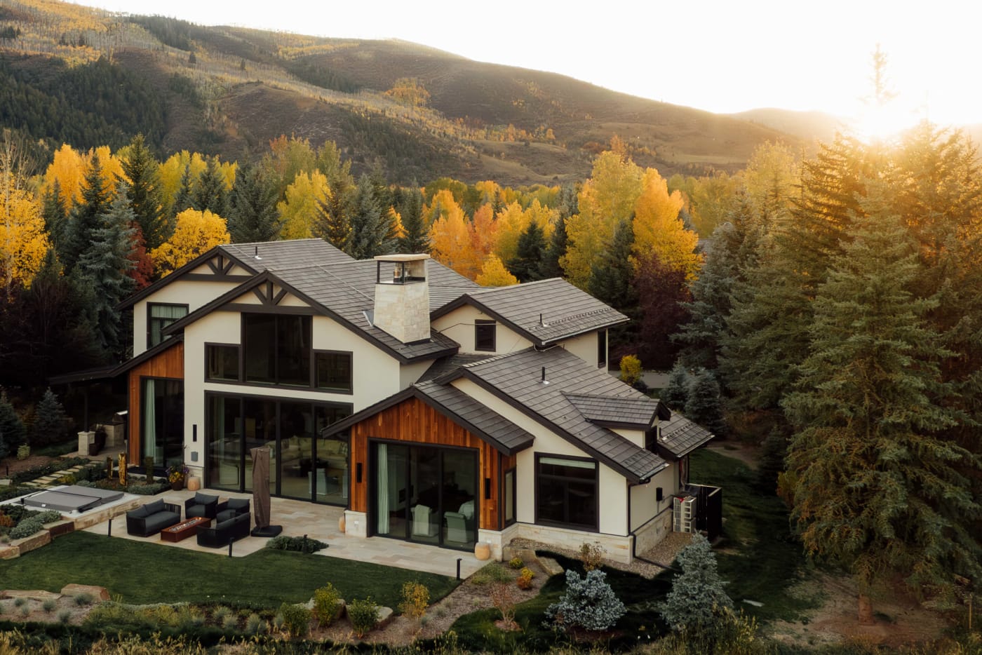 Country Club of the Rockies — contemporary home amid golden aspens at sunset