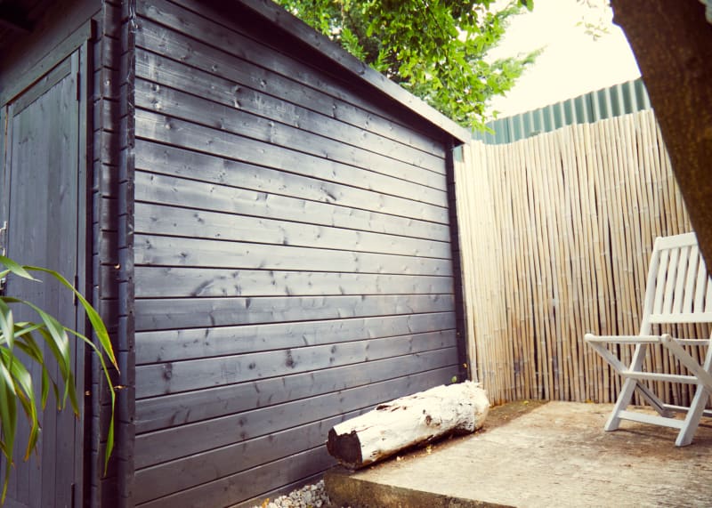 bamboo_wall_with_chair_next_to_shed_outdoor_shoot_and_tv_locations_UK