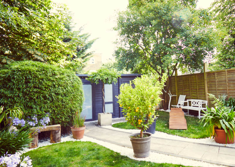 wide_outdoor_garden_shot_stone_bench_shed_lounger_location_shoot_setting_uk_for_hire