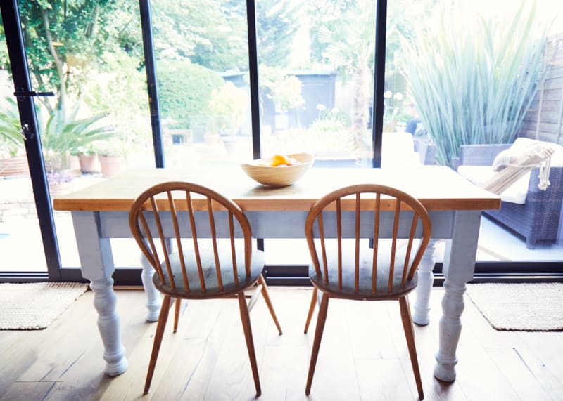 wooden_dining_kitchen_table_facing_bay_door_windows_location_house_management_uk