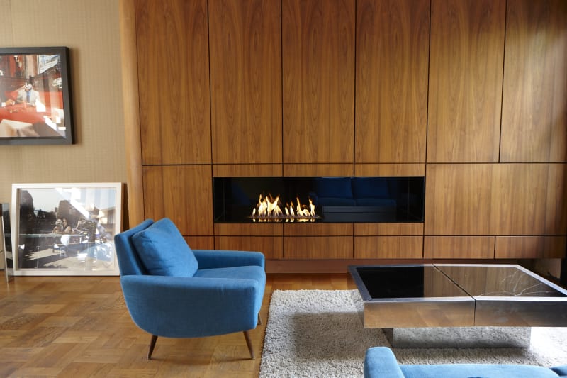 haverfield_1970s_indoor_living_room_blue_chairs_with_fireplace_in_wall_modern_photoshoot_film_location_for_hire