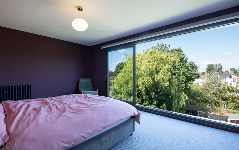 unique_purple_bedroom_large_window_photoshoot_location_house_management_location_agency_uk