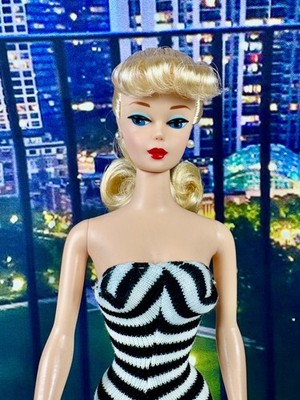 Sleek Strapless Swimsuit with High Ponytail and Sunglasses