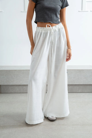 Embellished Sandals and Crochet Bag with Loose Linen Pants